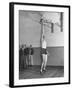 Basketball Player Max Palmer Reaching Up to Drop Basketball into Basket-null-Framed Photographic Print