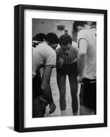 Basketball Player Tom Gola in a Huddle During a Basketball Game-null-Framed Photographic Print