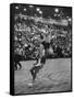 Basketball Player Tom Gola Leaping in the Air to Make a Shot During a Basketball Game-null-Framed Stretched Canvas