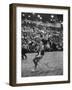 Basketball Player Tom Gola Leaping in the Air to Make a Shot During a Basketball Game-null-Framed Photographic Print