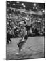 Basketball Player Tom Gola Leaping in the Air to Make a Shot During a Basketball Game-null-Mounted Photographic Print