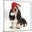 Basset Hound Puppy, Betty, 9 Weeks, Sitting, Wearing a Father Christmas Hat-Mark Taylor-Mounted Photographic Print