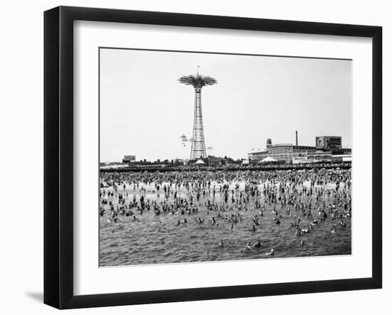 Bathers Enjoying Coney Island Beaches. Parachute Ride and Steeplechase Park Visible in the Rear-Margaret Bourke-White-Framed Photographic Print