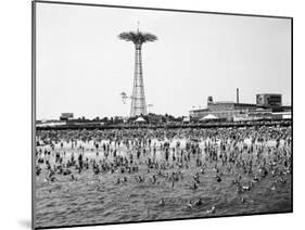Bathers Enjoying Coney Island Beaches. Parachute Ride and Steeplechase Park Visible in the Rear-Margaret Bourke-White-Mounted Photographic Print