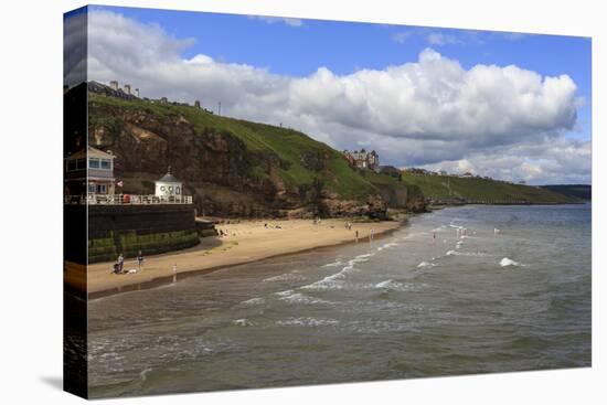 Bathers on West Cliff Beach, Backed by Grassy Cliffs in Summer, Whitby, North Yorkshire, England-Eleanor Scriven-Stretched Canvas