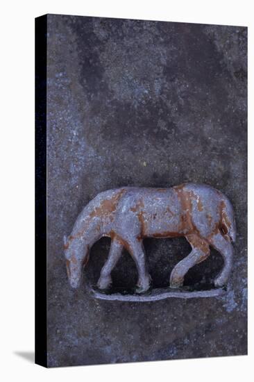 Battered Lead Model of Grazing Horse Lying on Tarnished Metal-Den Reader-Stretched Canvas