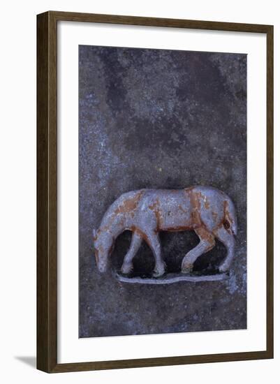 Battered Lead Model of Grazing Horse Lying on Tarnished Metal-Den Reader-Framed Photographic Print