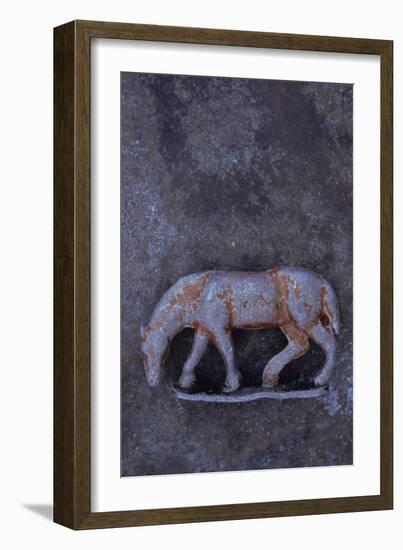 Battered Lead Model of Grazing Horse Lying on Tarnished Metal-Den Reader-Framed Photographic Print