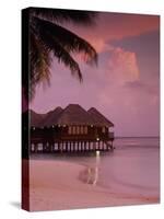Beach and Water Villas at Sunset, Maldive Islands, Indian Ocean-Calum Stirling-Stretched Canvas