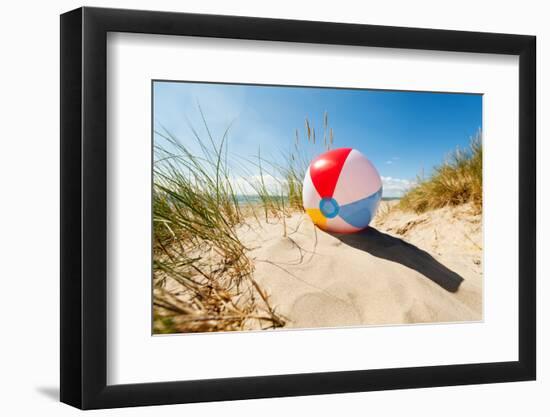 Beach Ball Resting in Sand Dune Concept for Childhood Summer Vacations, Family Holiday and Healthy-Flynt-Framed Photographic Print