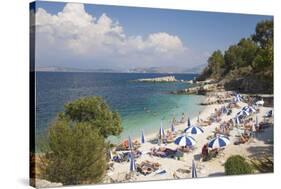 Beach Crowded with Holidaymakers, Kassiopi, Corfu, Ionian Islands, Greek Islands, Greece, Europe-Ruth Tomlinson-Stretched Canvas