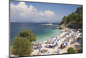 Beach Crowded with Holidaymakers, Kassiopi, Corfu, Ionian Islands, Greek Islands, Greece, Europe-Ruth Tomlinson-Mounted Photographic Print