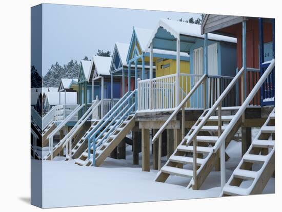 Beach Huts in the Snow at Wells Next the Sea, Norfolk, England-Jon Gibbs-Stretched Canvas