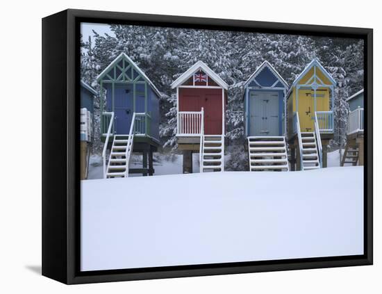 Beach Huts in the Snow at Wells Next the Sea, Norfolk, England-Jon Gibbs-Framed Stretched Canvas