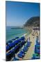 Beach umbrellas lining the beach in Monterosso al Mare, Cinque Terre, Italy.-Michael DeFreitas-Mounted Photographic Print