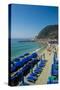 Beach umbrellas lining the beach in Monterosso al Mare, Cinque Terre, Italy.-Michael DeFreitas-Stretched Canvas