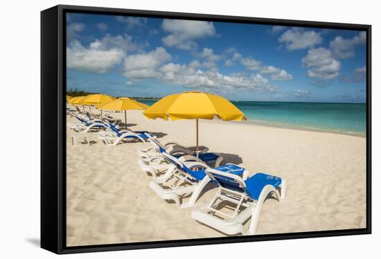 Beach umbrellas on Grace Bay Beach, Providenciales, Turks and Caicos Islands, Caribbean.-Michael DeFreitas-Framed Stretched Canvas