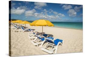 Beach umbrellas on Grace Bay Beach, Providenciales, Turks and Caicos Islands, Caribbean.-Michael DeFreitas-Stretched Canvas