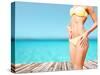 Beach, Vacation, Summer Holidays and Body Concept - Closeup of Female Body in Bikini at Beach-dolgachov-Stretched Canvas