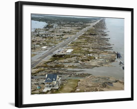 Beachfront Home Stands Among the Debris in Gilchrist, Texas after Hurricane Ike Hit the Area-null-Framed Photographic Print