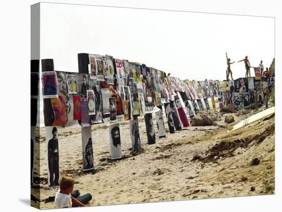 Beachgoers Climb on a Display of Posters, Montauk Point, Long Island, New York, 1967-Henry Groskinsky-Stretched Canvas