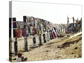 Beachgoers Climb on a Display of Posters, Montauk Point, Long Island, New York, 1967-Henry Groskinsky-Stretched Canvas