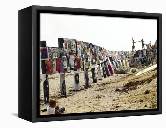 Beachgoers Climb on a Display of Posters, Montauk Point, Long Island, New York, 1967-Henry Groskinsky-Framed Stretched Canvas