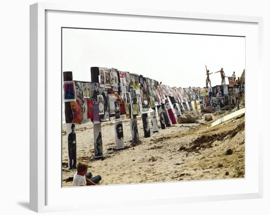 Beachgoers Climb on a Display of Posters, Montauk Point, Long Island, New York, 1967-Henry Groskinsky-Framed Photographic Print