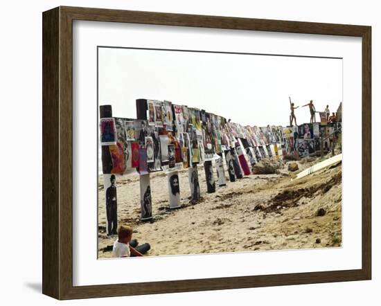 Beachgoers Climb on a Display of Posters, Montauk Point, Long Island, New York, 1967-Henry Groskinsky-Framed Photographic Print