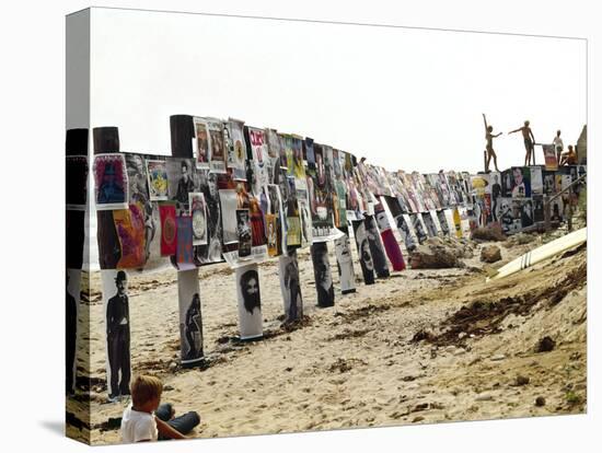 Beachgoers Climb on a Display of Posters, Montauk Point, Long Island, New York, 1967-Henry Groskinsky-Stretched Canvas