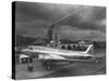 Beacon Shining Forth at Evening from Air Terminal Tower, American Airlines Plane in Foreground-null-Stretched Canvas