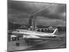 Beacon Shining Forth at Evening from Air Terminal Tower, American Airlines Plane in Foreground-null-Mounted Premium Photographic Print