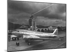 Beacon Shining Forth at Evening from Air Terminal Tower, American Airlines Plane in Foreground-null-Mounted Photographic Print