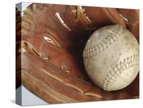 Beaten-Up Baseball in Baseball Glove-null-Stretched Canvas