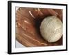 Beaten-Up Baseball in Baseball Glove-null-Framed Photographic Print