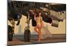 Beautiful 1940's Pin-Up Girl Standing with a B-25 Bomber-null-Mounted Photographic Print
