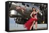 Beautiful 1940's Style Pin-Up Girl Standing under a B-17 Bomber-null-Framed Stretched Canvas