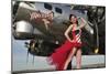 Beautiful 1940's Style Pin-Up Girl Standing under a B-17 Bomber-null-Mounted Premium Photographic Print