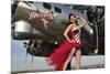 Beautiful 1940's Style Pin-Up Girl Standing under a B-17 Bomber-null-Mounted Photographic Print