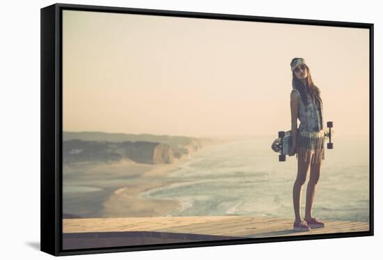 Beautiful And Fashion Young Woman Posing With A Skateboard-iko-Framed Stretched Canvas