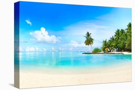 Beautiful Beach with White Sand, Turquoise Ocean, Green Palm Trees and Blue Sky with Clouds on Sunn-LedyX-Stretched Canvas