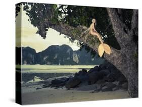 Beautiful Fashionable Mermaid Sitting On A Mighty Tree On The Beach-George Mayer-Stretched Canvas