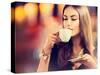 Beautiful Girl Drinking Tea or Coffee in Café-Subbotina Anna-Stretched Canvas