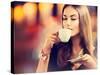 Beautiful Girl Drinking Tea or Coffee in Café-Subbotina Anna-Stretched Canvas