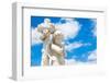 Beautiful Infant Angel Leaning on a Christian Cross with a Blue Sky Background (With Space for Text-Kamira-Framed Photographic Print
