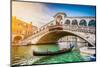 Beautiful View of Traditional Gondola on Famous Canal Grande with Rialto Bridge at Sunset in Venice-canadastock-Mounted Photographic Print