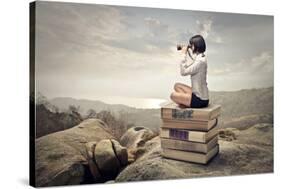 Beautiful Woman Sitting On A Pile Of Old Books Watching With Binoculars-olly2-Stretched Canvas