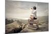 Beautiful Woman Sitting On A Pile Of Old Books Watching With Binoculars-olly2-Mounted Art Print