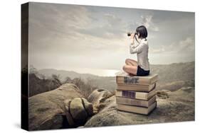 Beautiful Woman Sitting On A Pile Of Old Books Watching With Binoculars-olly2-Stretched Canvas