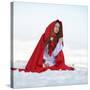 Beautiful Woman with Red Cloak Sitting on the Snow in Winter-mirceab-Stretched Canvas